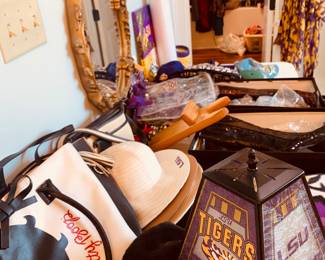 entire table of LSU clothing, hats, handbags, and scarves