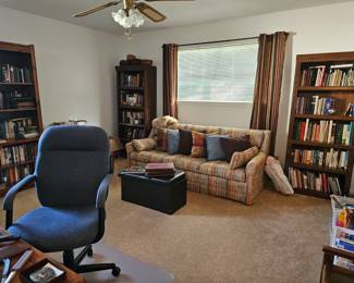 A view into the office wirh sofa sleeper, extra cover available