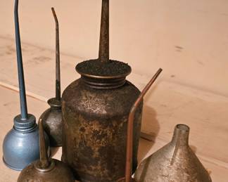 a selection of oil cans