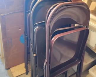 lots of folding chairs and three vintage folding tables