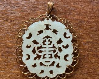 #101- $250 - 14kt gold mounted white jade pendant 