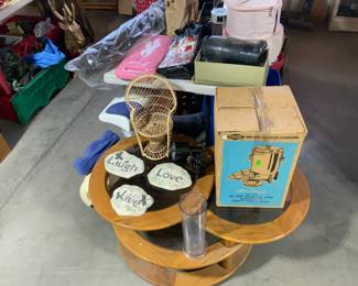 Awesome vintage multi tiered swivel coffee table. Smaller matching one inside the house.