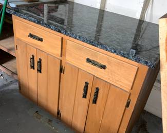 Freestanding kitchen island with granite countertop