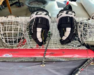 Hockey , net, hockey gear, hockey sticks,   hockey goalie gear