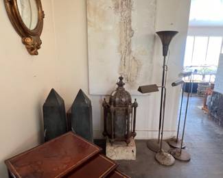 Gold Mirror, Stacking leather top tables, Obelisks, Brass Light Fixture, Original Paul Meyer large work of art, Floor/Bridge lamps.