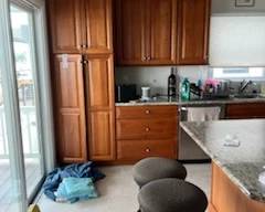 Kitchen cabinetry includes a pantry