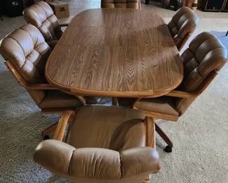 Vintage table and 6 chairs on rollers