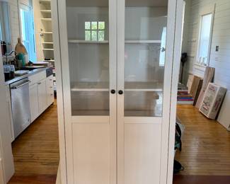 White glass front storage cabinet 35”wide x 78” tall