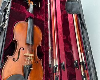 Violin in case with bows