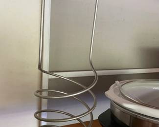 unique metal items. not sure .. maybe wine bottle?