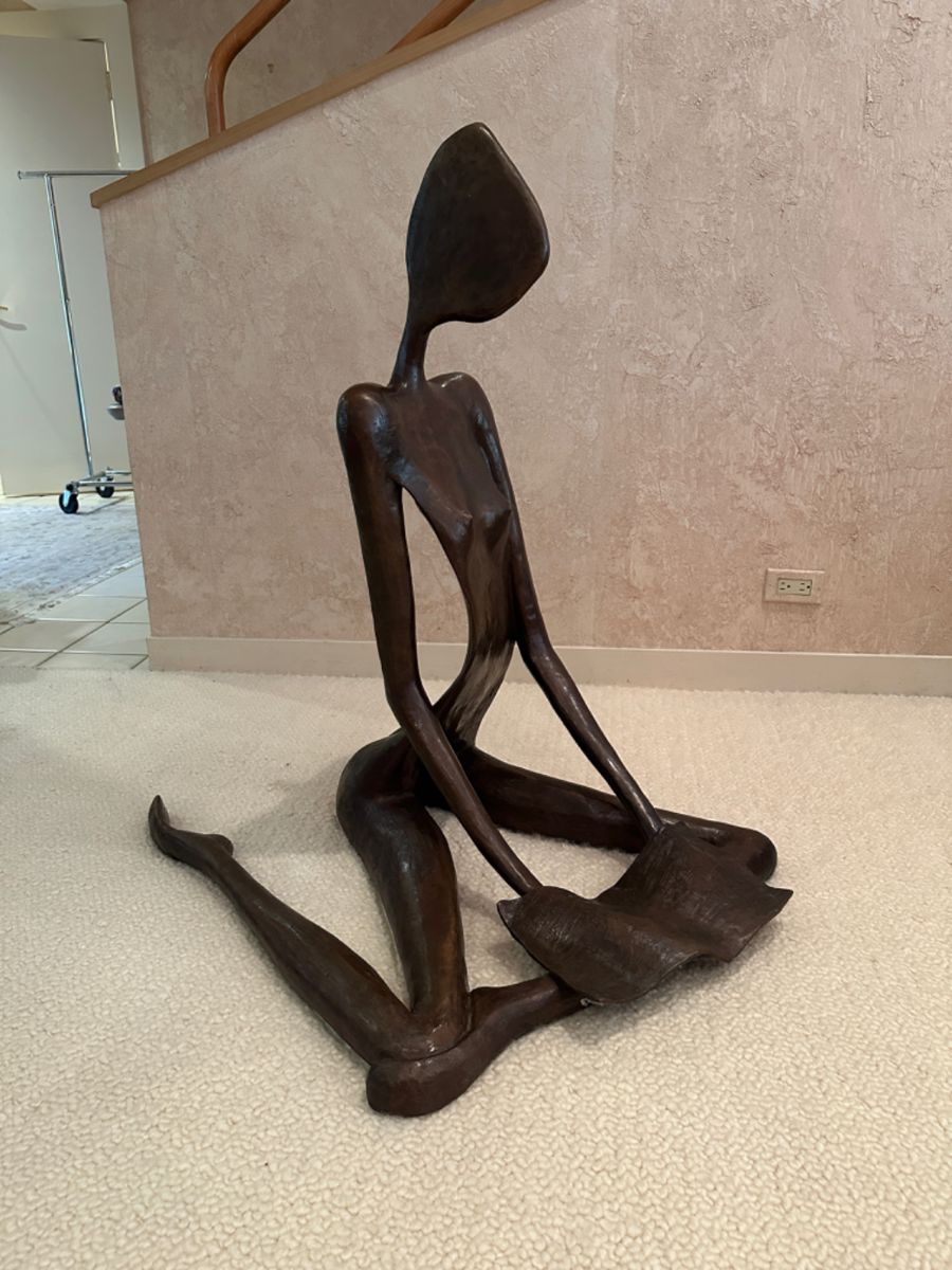 Bronze Figure reading a book, signed and numbered, by John Kennedy. Measures approx. 39"x39"x39" 