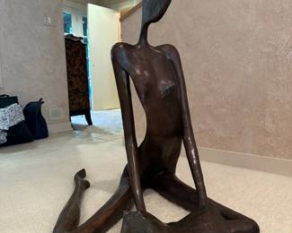 Bronze Figure reading a book, signed and numbered, by John Kennedy. Measures approx. 39"x39"x39" 
