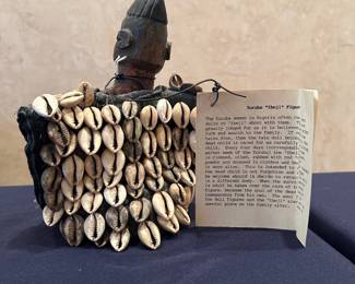 Yoruba 'Ibeji'  figure in a cowrie shell covered garment, Nigeria