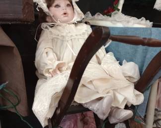 DOLL IN A DOLL HIGH CHAIR