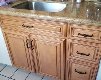 Kitchen cabinet detail; includes faucet & sink