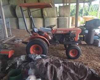 Kabota E6100 tractor with tiller spreader attachment