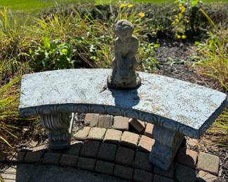 Elegant garden bench and statue