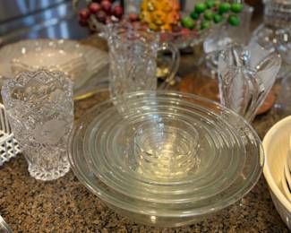 Nesting bowls, crystal pitchers and vases