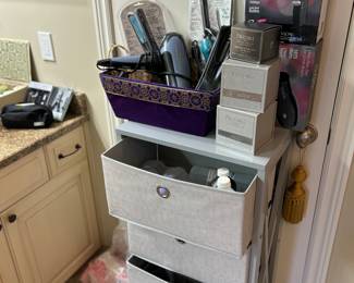 Storage dresser, curling irons, straighteners, hair dryers