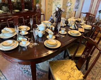 Beautiful imported dark cherry rosewood dining table (mother of pearl inlay) with 6 chairs and two leaves. Cushions are removable for complete wood chairs