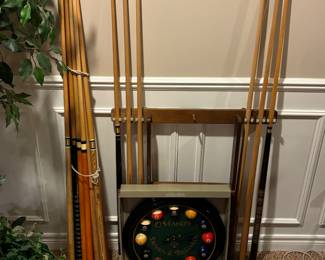 Pool balls, sticks, rack, clock