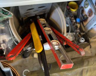 Large wrenches, crow bars, levels