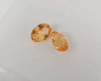 Lot # : 633 - 1.15ctw Pair of oval mandarin garnet gemstones