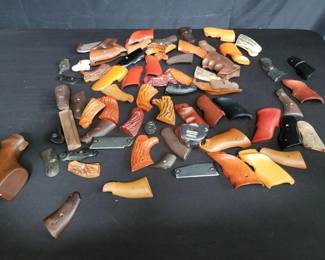 Lot # : 312 - Group of gun grips - plastic, wood, etc.