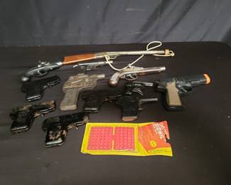 Lot # : 357 - Box of vintage toy guns and lighters