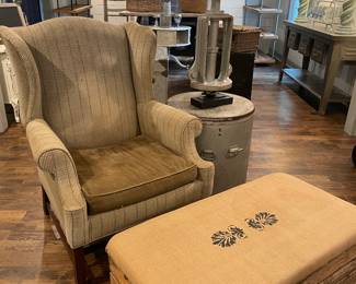 Burlap Ottoman and Upholster Wingback Chair. Round Barrel Table and Unique Industrial Style Lamp