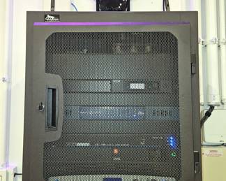 Crown CDi 2000 2-Channel Power Amplifier, Juice Goose SQ 1500 7-Outlet Power Sequencer, BSS Audio BLU-50 4x4 Signal Processor With BLU Link, And GLXD4 Shure Vocal Dual Channel Wireless Microphone System, Includes Wall Mounted Storage Cabinet 