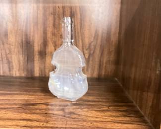 Clear, violin shaped bottle