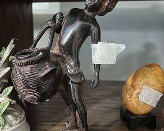 Statue in shelf unit 