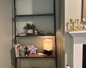 Close up of 4 tier shelf unit in living room 
