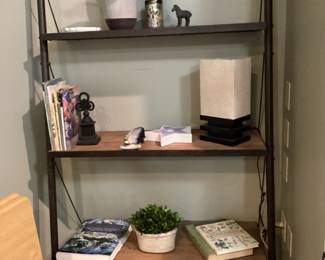 Four tier shelf with decor