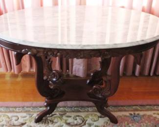 27 - Oval Carved Marble Top Parlor Table 29" x 46" x 28"

