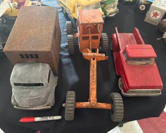 Old pressed steel toy vehicles Smitty armored truck, Structo grader, and an old Tonka pickup.  