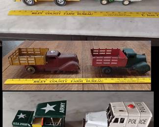 Lots of old toy vehicles in this sale.  These are Structo emergency truck,  Tonka RV Camper, Wyandotte farm stake trucks,japanese friction Jeep and Police