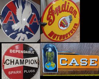 Many porcelain signs in this auction, these are American Airlines, Indian Motorcycles, Case Tractors, and Champion Spark Plugs. 