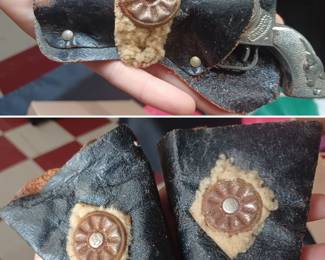 Smoky cap gun with holster and 2 matching wrist cowboy cuffs, there are other toys in the lot with these including an antique Bing locomotive. 