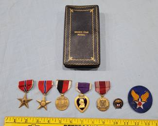 several lots in this sale have old military collectibles, this one has 2 bronze stars, a purple heart and more. 
