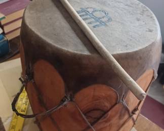 Hide drum with beater, Native American rain cloud symbol on drum head. 