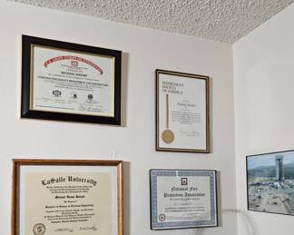 Certifications and diplomas framed $8 each on this wall