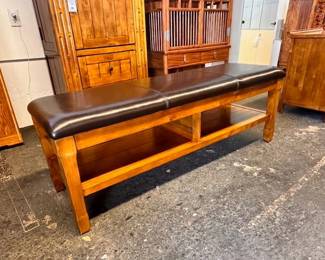 $350 Brown leather and wood, long bench 58 x 18 x 19