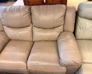 $375 Taupe leather loveseat, raise legs 64 x 40 x 36