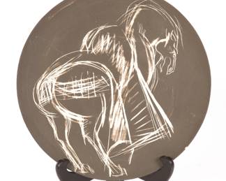 Dali style sgraffito ceramic plate