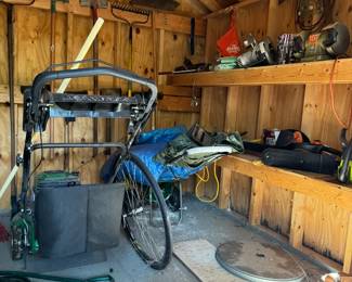 Lawnmower, tool box, hoses, garden equipment, and more.