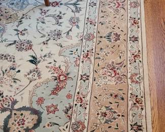 Persian Tabriz 9' x 12' is cream, celadon green, and ruby purchased at the Rugmart at the Williamsburg Pottery Factory, in dining area