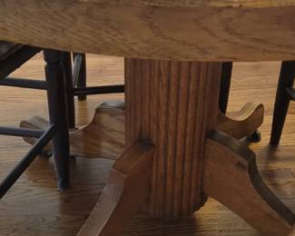 Oak table on casters with leaf, four rush seat chairs