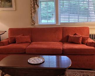 Plush sofa in velveteen vermillion fabric, pair of Pembroke side tables, coffee table